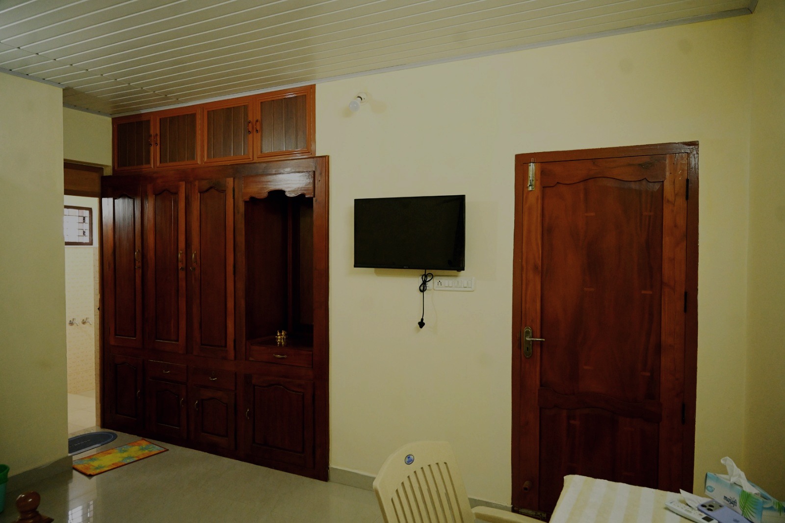 Living space with television and wardrobe